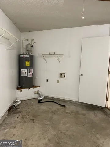 a room with gym equipment and a shower