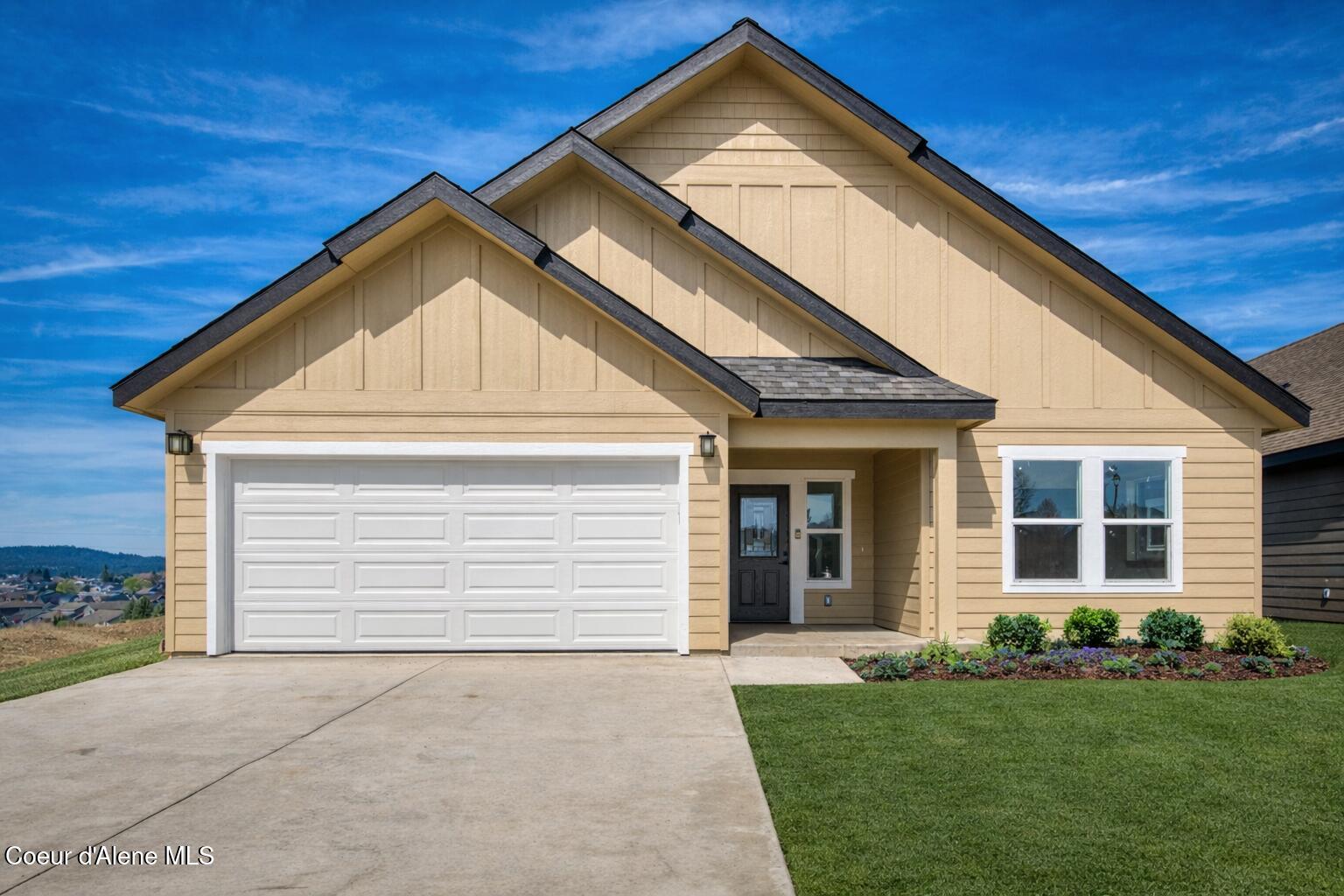 3606 Blaze Loop Post Falls, ID 83854 - Photo 1 of 38 Suburban home with landscaped garden