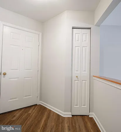 an empty room with wooden floor