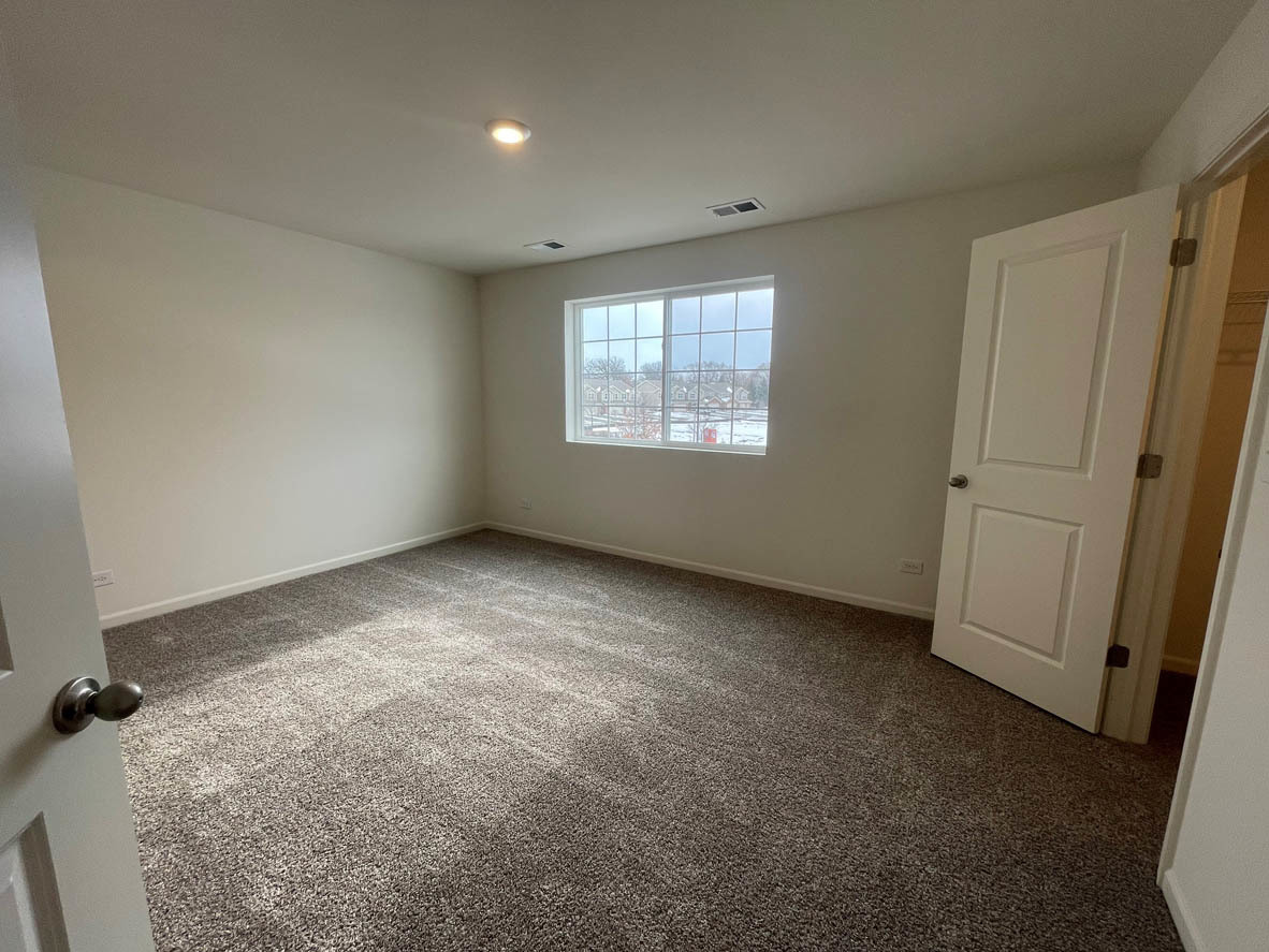 762 Westbury Drive Cary, IL 60013 - Photo 13 of 21 an empty room with windows