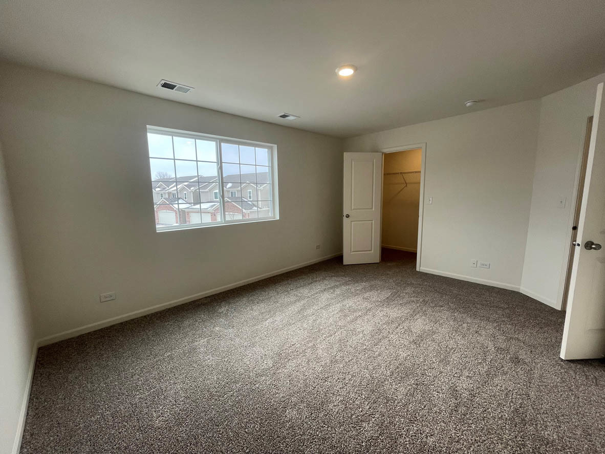 762 Westbury Drive Cary, IL 60013 - Photo 14 of 21 an empty room with windows