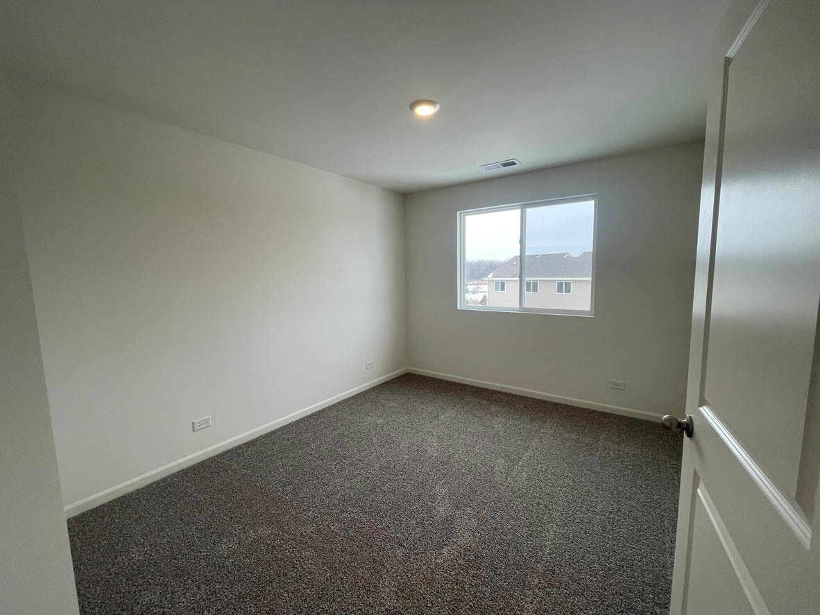 762 Westbury Drive Cary, IL 60013 - Photo 20 of 21 an empty room with a window