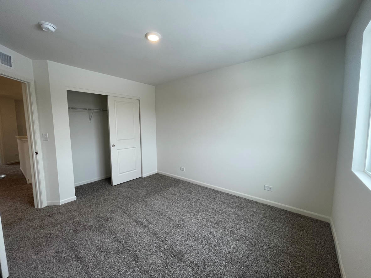 762 Westbury Drive Cary, IL 60013 - Photo 21 of 21 an empty room with closet area