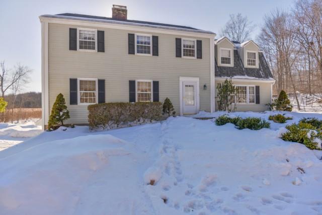 300 Cannon Road Wilton, CT 06897 - Photo 1 of 1 a front view of a house with a yard