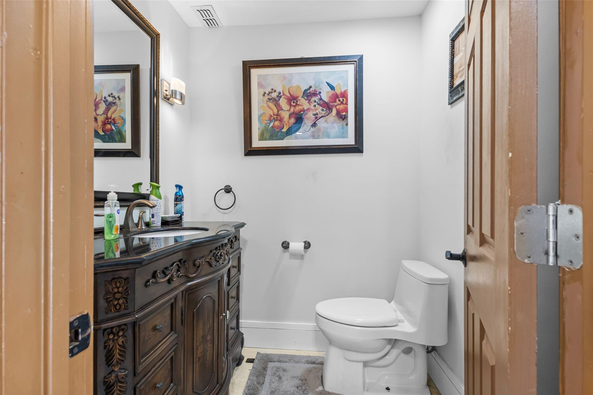 5223 Deerhurst Crescent Circle Boca Raton, FL 33486 - Photo 30 of 51 a bathroom with a granite countertop toilet a sink and a mirror