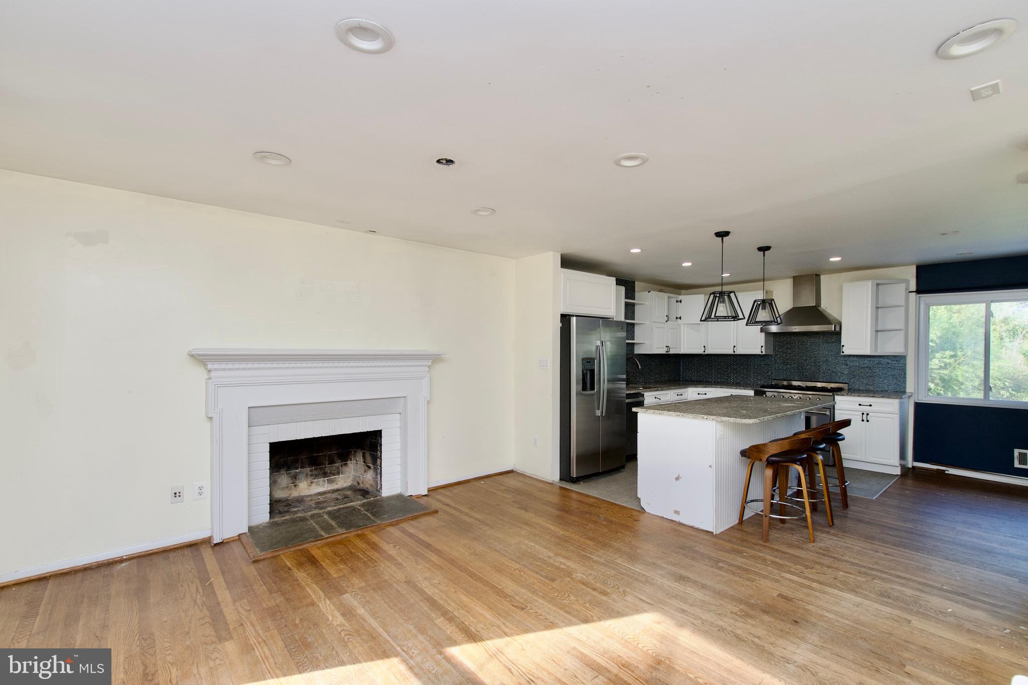 7538 Axton Street Springfield, VA 22151 - Photo 3 of 38 Open living area with hardwoods & fireplace!