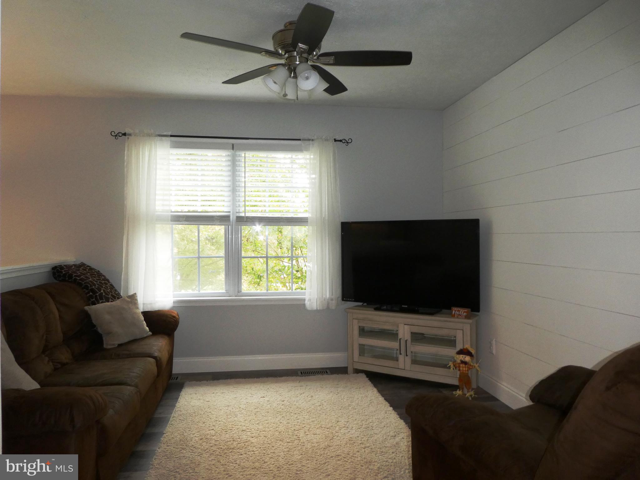 14 Springhouse Court Rising Sun, MD 21911 - Photo 4 of 13 a living room with furniture and a flat screen tv
