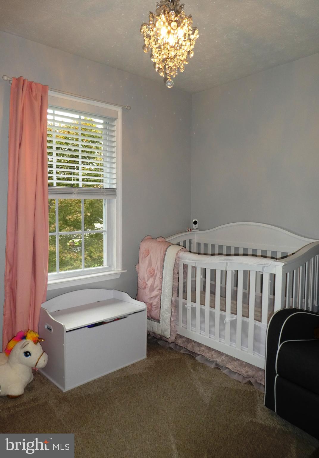 14 Springhouse Court Rising Sun, MD 21911 - Photo 8 of 13 a spacious bedroom with a bed and a window
