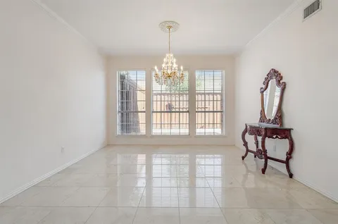 a view of a room with windows and lounge chairs