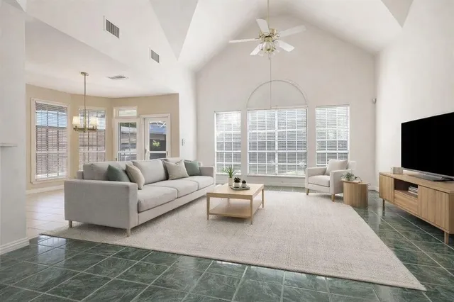 a kitchen with stainless steel appliances granite countertop a sink counter space cabinets and a stove
