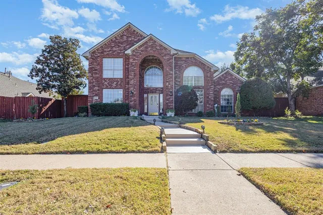 a living room with furniture a flat screen tv and a window