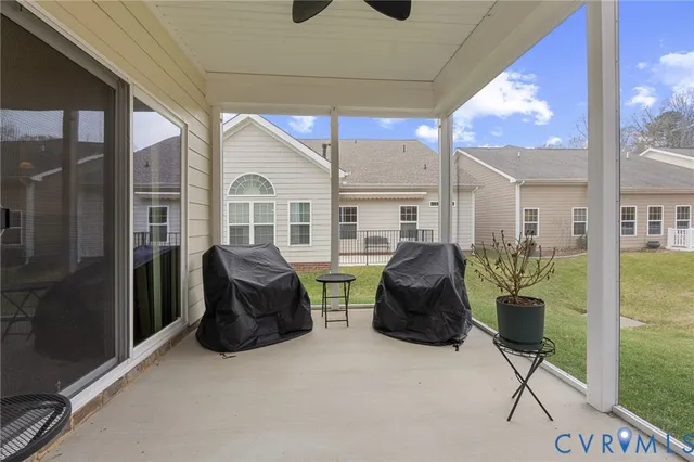 a view of two chairs in the balcony