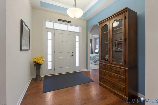 a view of hallway with wooden floor