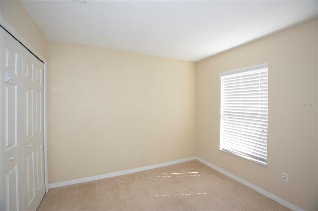 11919 Essington Street New Port Richey, FL 34654 - Photo 21 of 46 a view of an empty room with a window