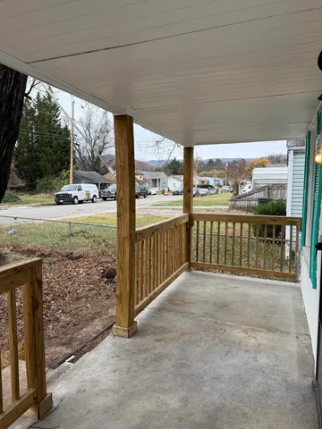 a front view of a house with large garden