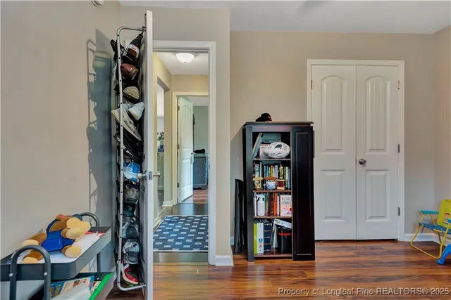 a view of an entryway with wooden floor