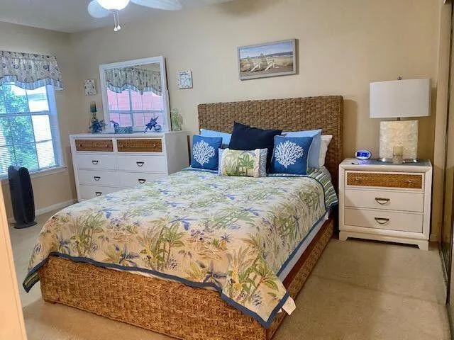 a bedroom with a bed and lamp