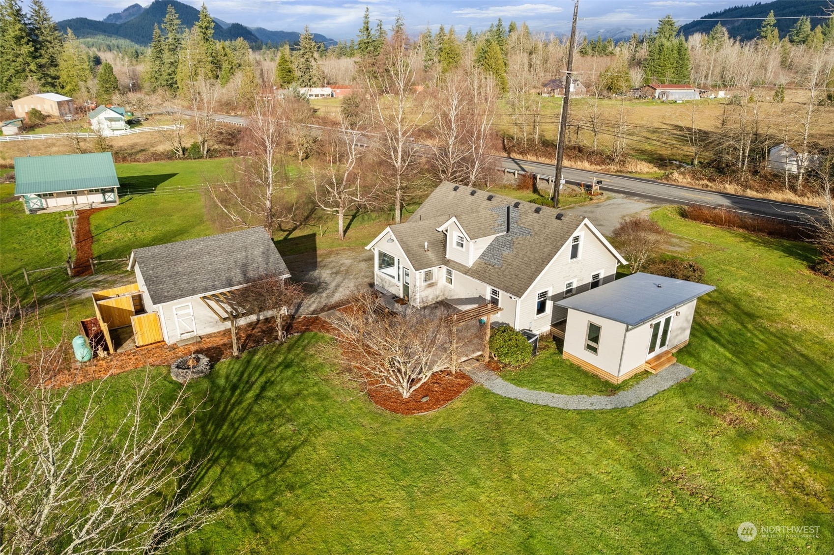 2628 Old Highway 99 North Road Burlington, WA 98233 - Photo 1 of 40 a view of a swimming pool with lawn chairs