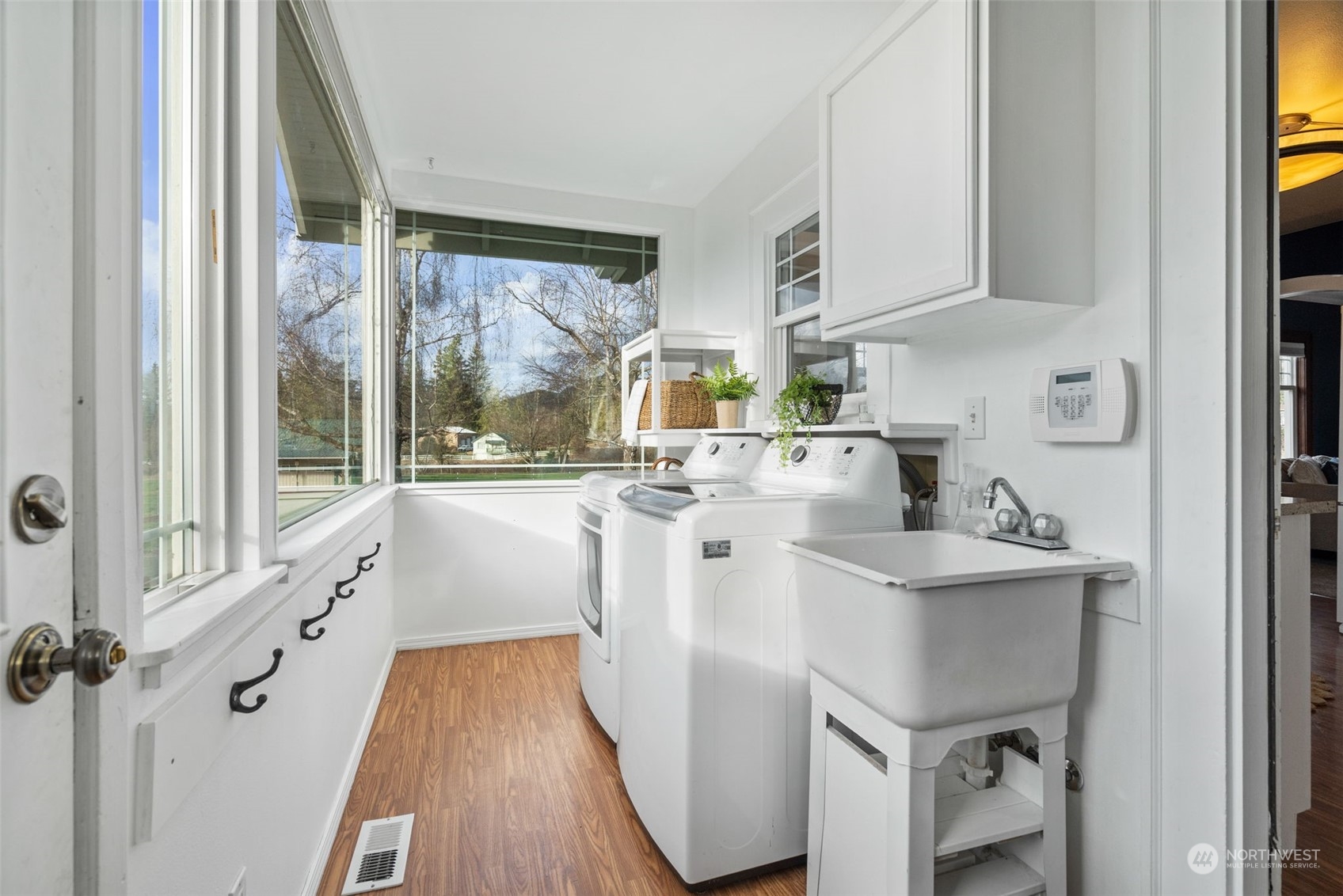 2628 Old Highway 99 North Road Burlington, WA 98233 - Photo 12 of 40 a kitchen with sink cabinets and wooden floor