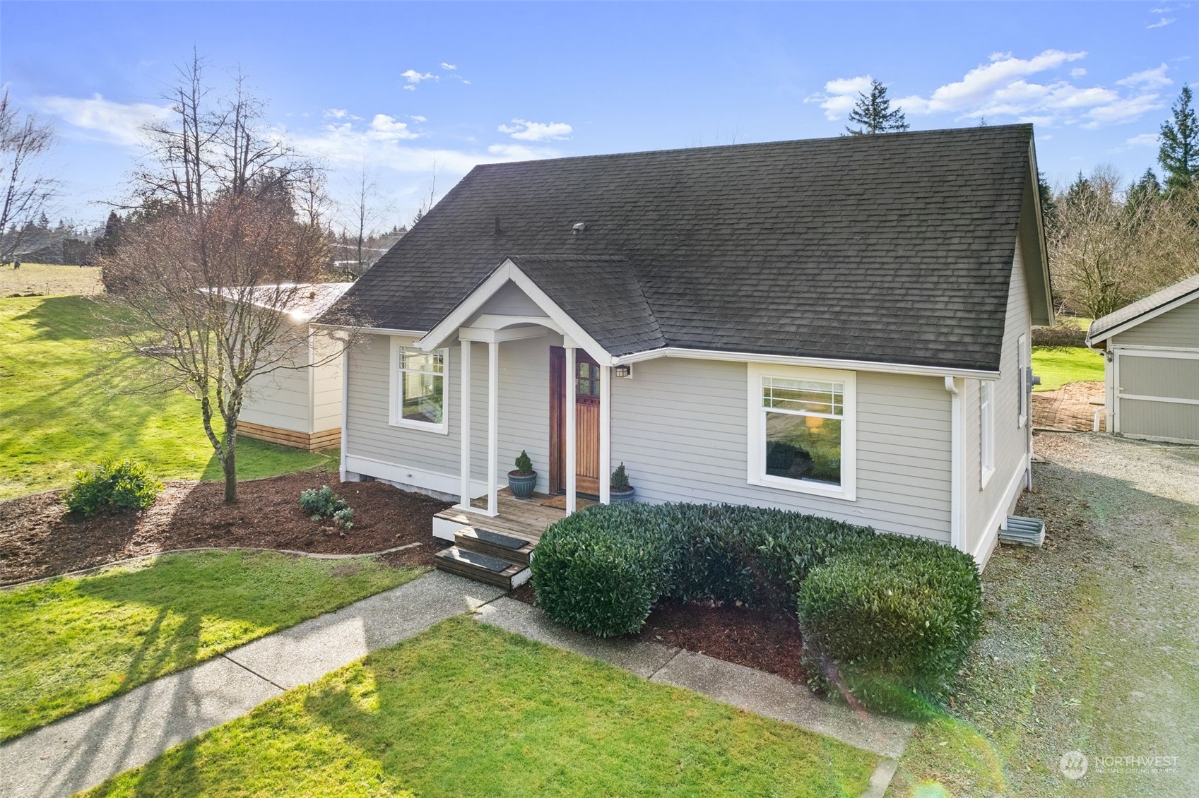 2628 Old Highway 99 North Road Burlington, WA 98233 - Photo 3 of 40 a front view of a house with garden