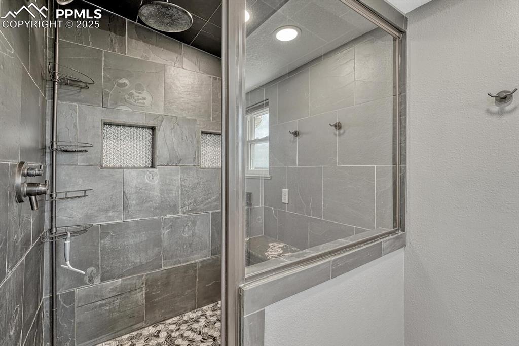 15371 Buck Creek Road Elbert, CO 80106 - Photo 13 of 50 a bathroom with a shower