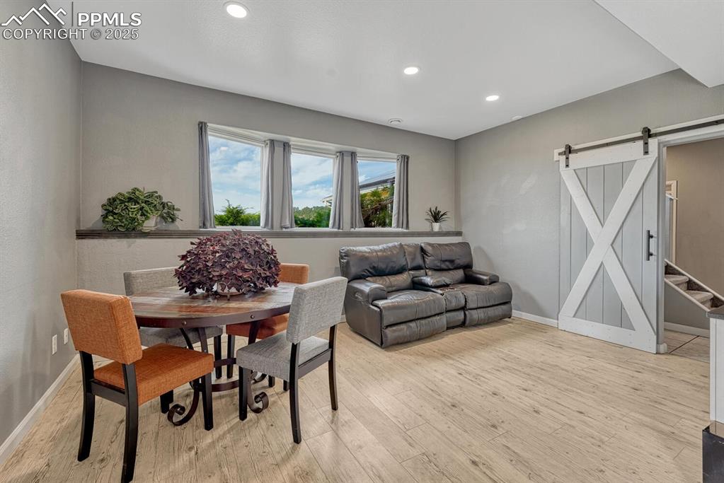 15371 Buck Creek Road Elbert, CO 80106 - Photo 21 of 50 a living room with furniture and a flat screen tv