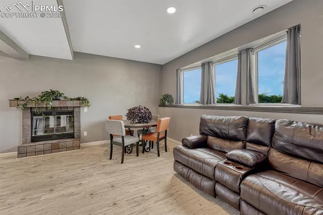 a view of a livingroom with furniture and a fireplace