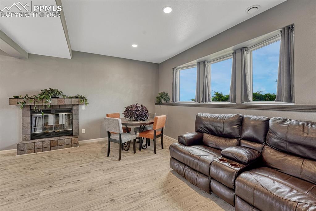 15371 Buck Creek Road Elbert, CO 80106 - Photo 22 of 50 a living room with furniture and wooden floor