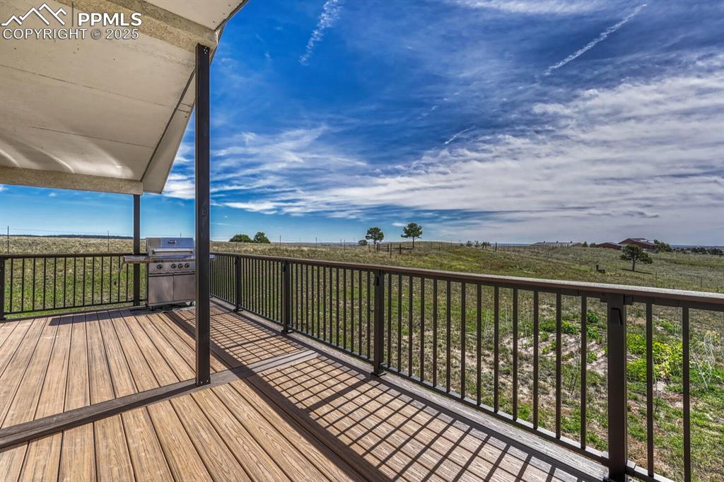 15371 Buck Creek Road Elbert, CO 80106 - Photo 32 of 50 a view of balcony with wooden floor