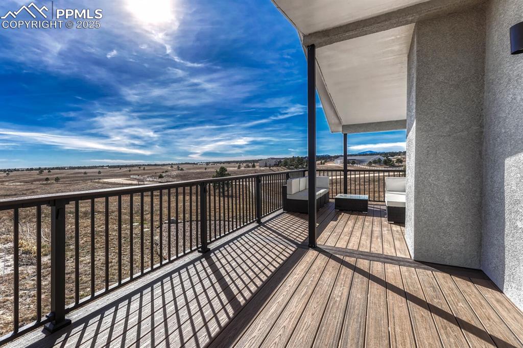 15371 Buck Creek Road Elbert, CO 80106 - Photo 33 of 50 a view of balcony with wooden floor