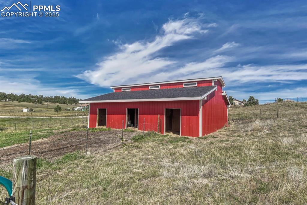 15371 Buck Creek Road Elbert, CO 80106 - Photo 34 of 50 a house with river in front of it