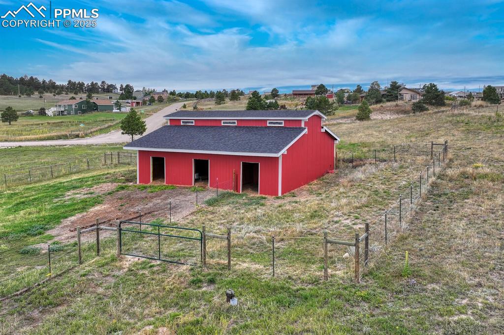 15371 Buck Creek Road Elbert, CO 80106 - Photo 35 of 50 an aerial view of a house with a yard basket ball court and outdoor seating