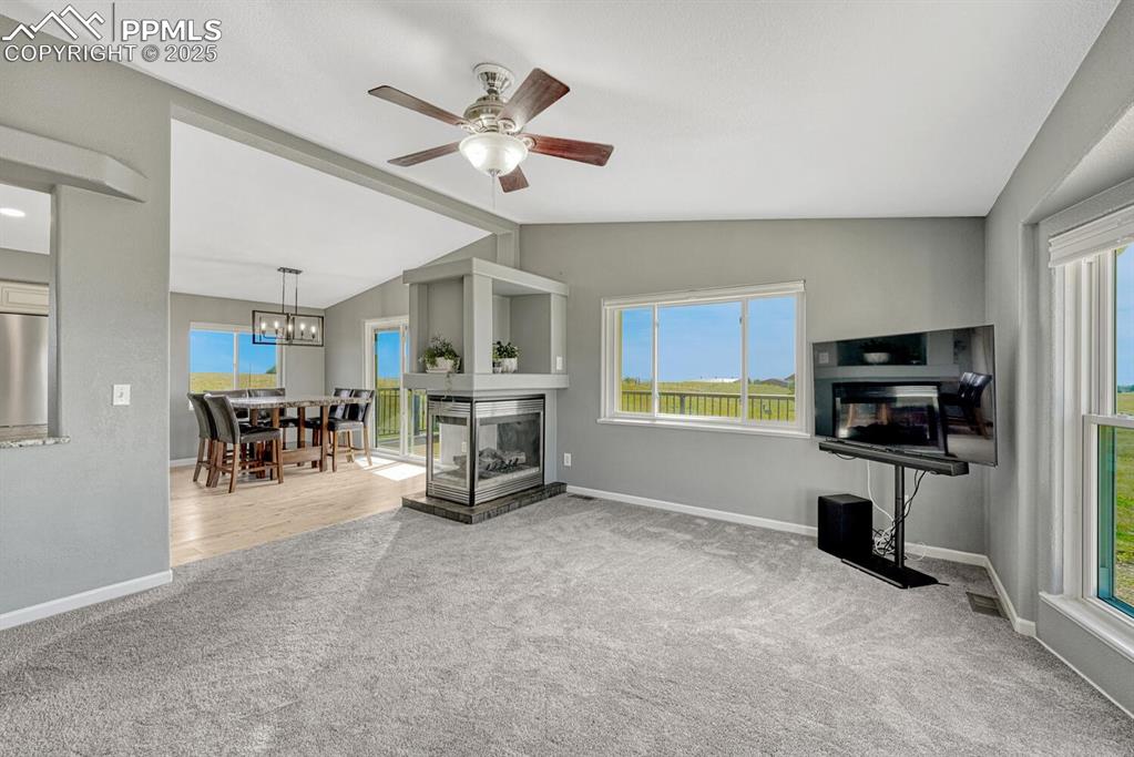 15371 Buck Creek Road Elbert, CO 80106 - Photo 9 of 50 a view of a livingroom with furniture and a flat screen tv