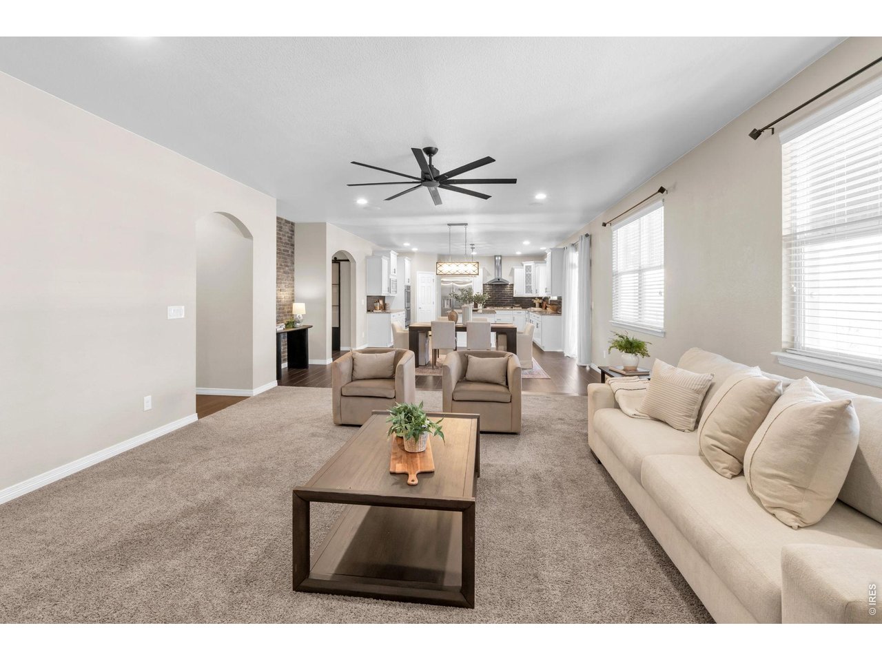 6028 Moran Road Timnath, CO 80547 - Photo 13 of 49 a living room with furniture kitchen view and a large window