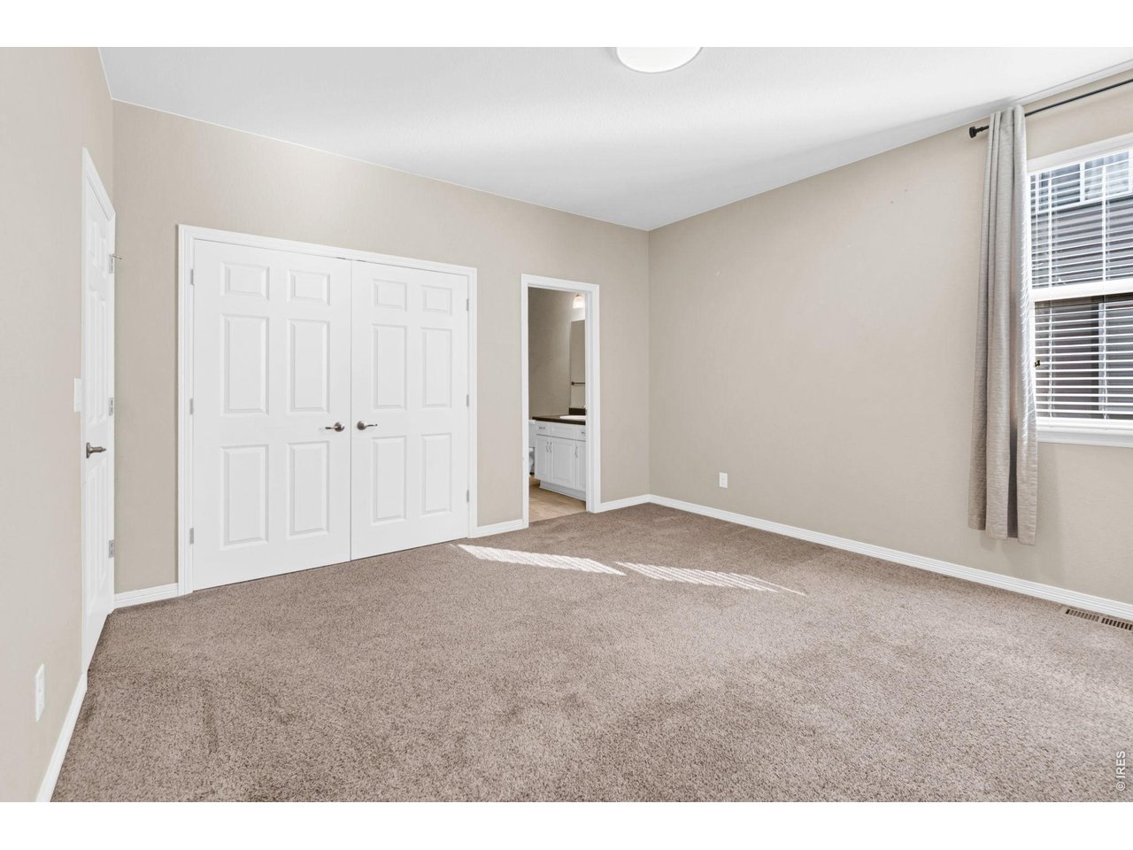 6028 Moran Road Timnath, CO 80547 - Photo 21 of 49 a view of an empty room with a window