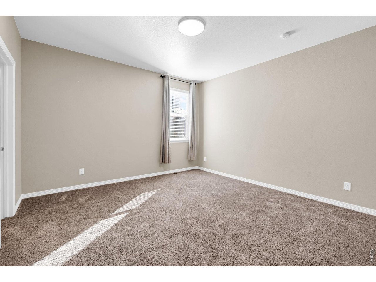 6028 Moran Road Timnath, CO 80547 - Photo 22 of 49 a view of an empty room and window