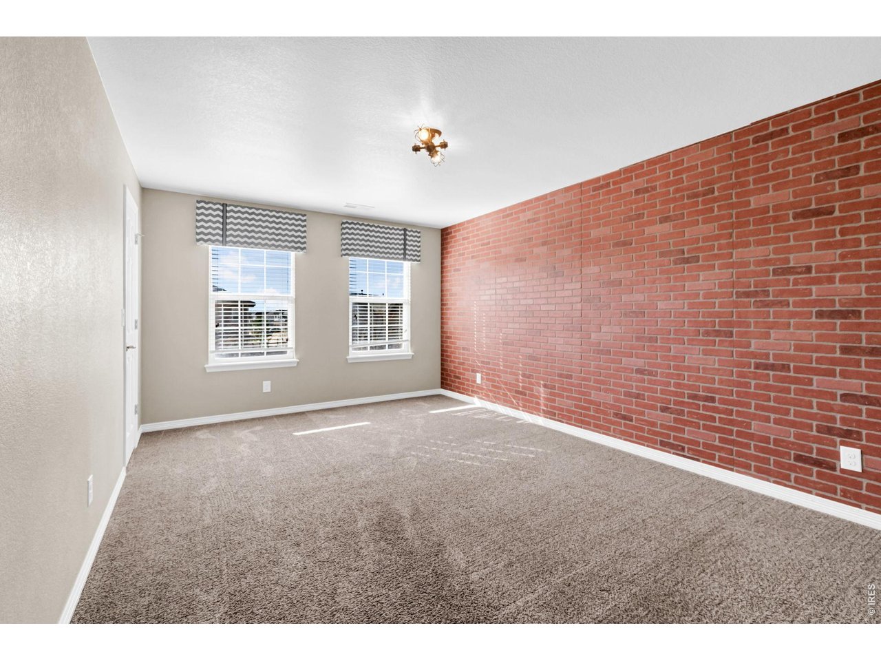 6028 Moran Road Timnath, CO 80547 - Photo 24 of 49 a view of an empty room with windows