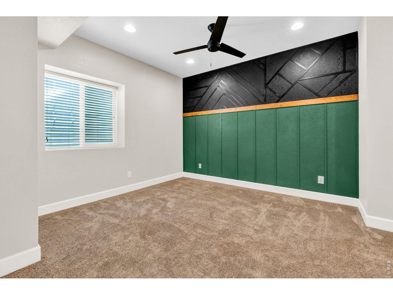 6028 Moran Road Timnath, CO 80547 - Photo 41 of 49 a view of an empty room with a window and a ceiling fan