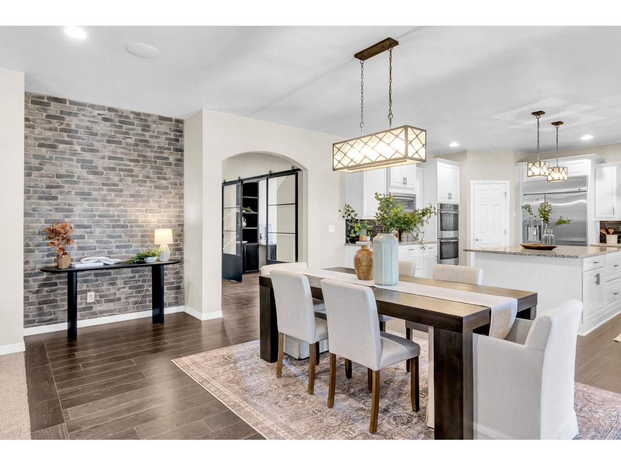 6028 Moran Road Timnath, CO 80547 - Photo 6 of 49 a view of a dining room with furniture and wooden floor