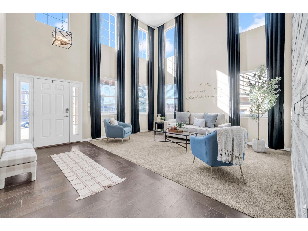 6028 Moran Road Timnath, CO 80547 - Photo 7 of 49 a living room with furniture and large windows