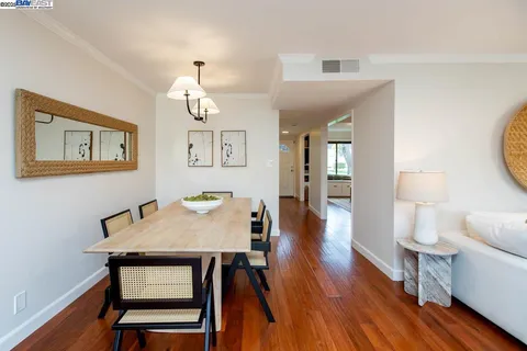 a kitchen with a refrigerator and a sink