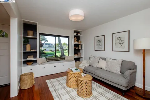 a building outdoor space with patio furniture and potted plants