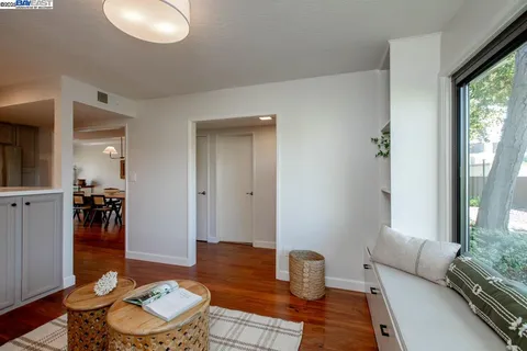 a backyard of a house with table and chairs