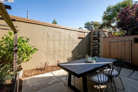 a bedroom with a bed and a potted plant
