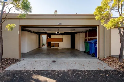 a bedroom with a bed and a sink