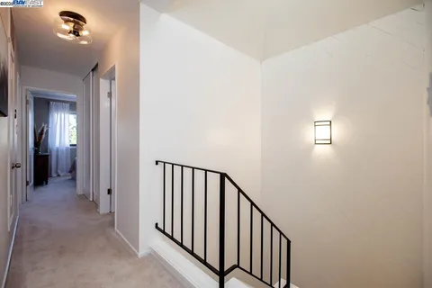 a bathroom with a granite countertop sink a toilet and a bathtub
