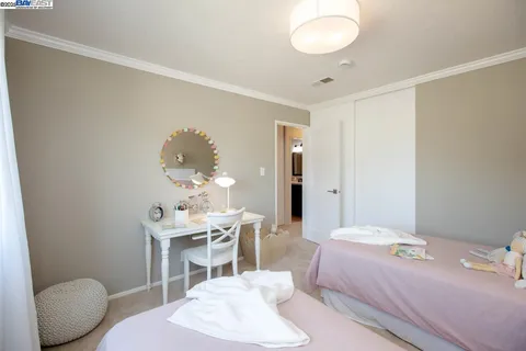 a view of swimming pool is middle in the garden