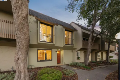 a bedroom with two beds and a dresser
