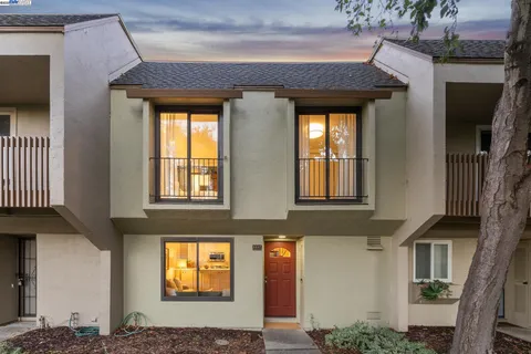 a bedroom with a workspace