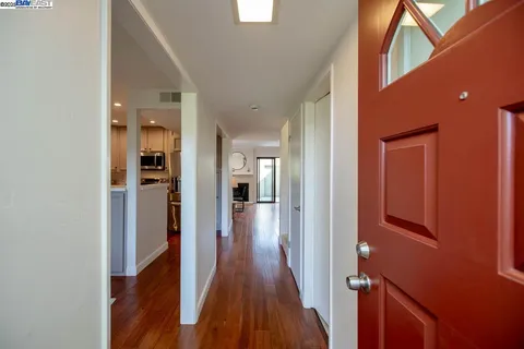 a living room with table a couch and a dining table